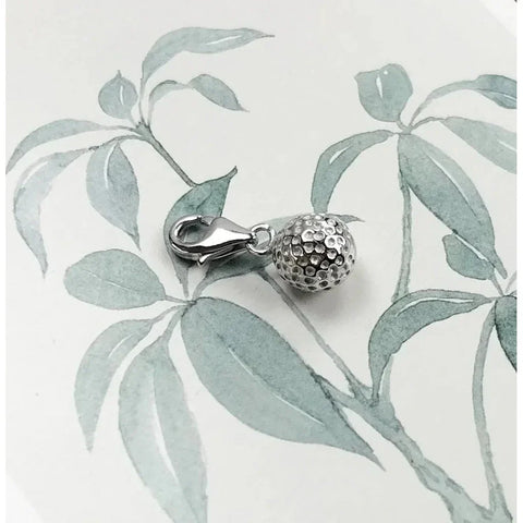 Silver golf ball charm.