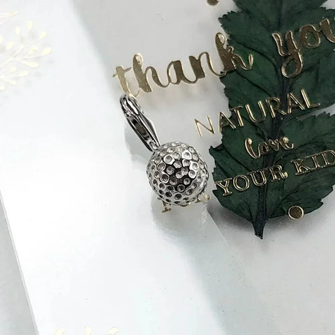 Silver golf ball pendant.