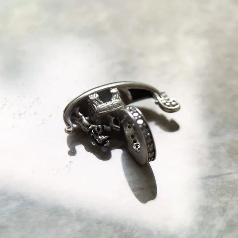 Silver dragon-themed hinged bracelet.