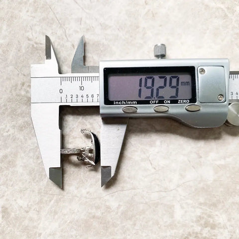Digital caliper measuring a ring.