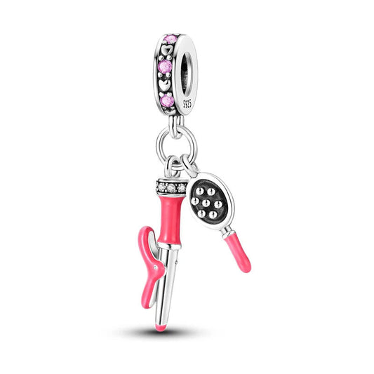 Silver hairdryer and comb charm with bright pink accents.