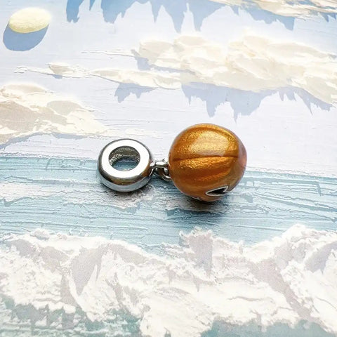 Golden pumpkin charm.