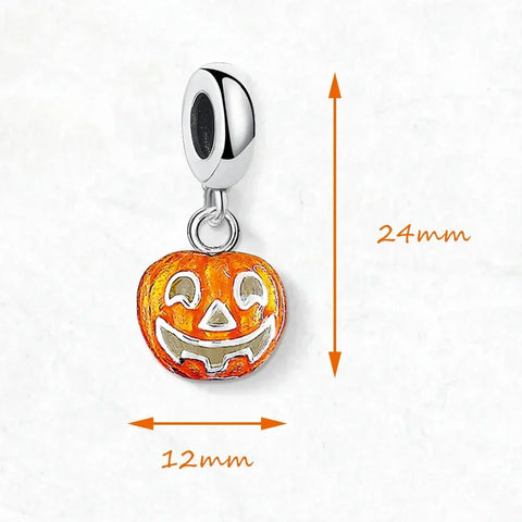 Orange pumpkin charm with silver accents.