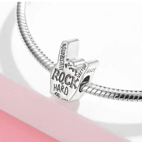 Silver rock-on hand charm.