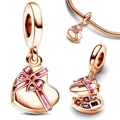 Heart Gift Box Charm in rose gold with a pink bow, featuring a heart-shaped box that opens to reveal detailed tiny gifts inside.
