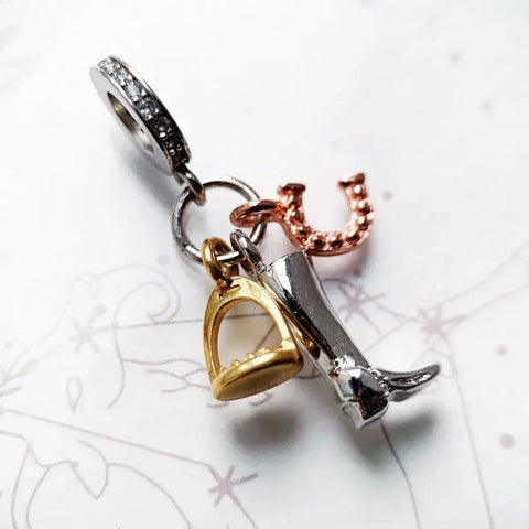 Equestrian-themed charm bracelet pendant.