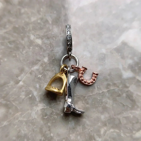 Equestrian-themed charm pendant.
