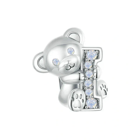 Silver teddy bear charm with jeweled letter.