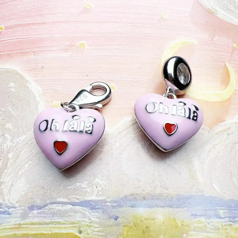 Two pink heart-shaped charms.