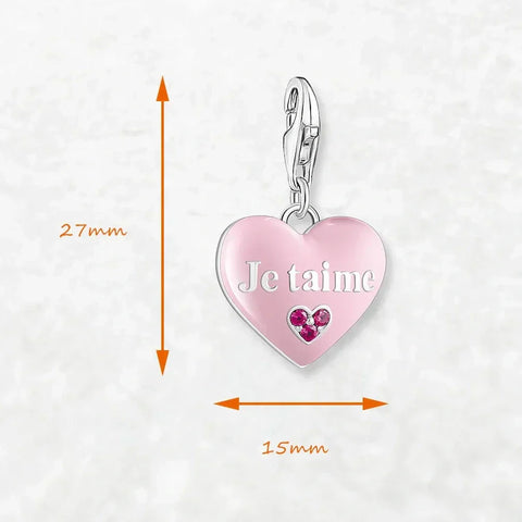 Pink heart charm with silver clasp.