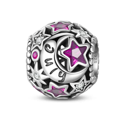Silver charm with stars and moon.