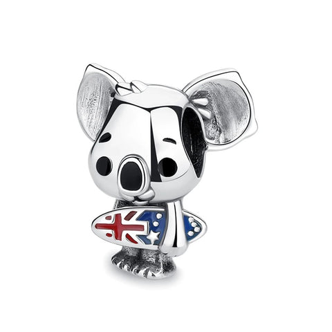 Surfing Koala Australian Flag Clip-On Charm - Silver-tone clip-on charm shaped like a cartoon winking koala bear holding a surfboard decorated with red and blue Australian flag enamel