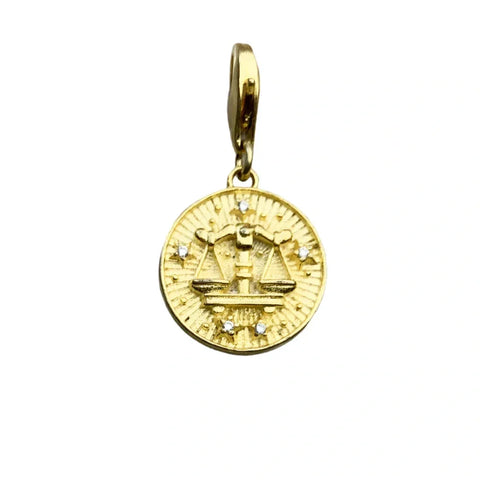 Gold Libra zodiac charm.