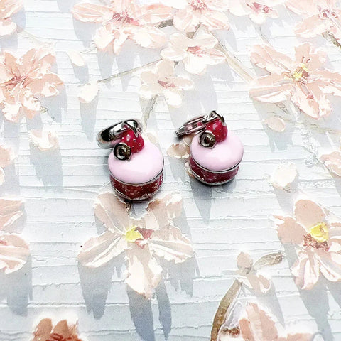 Strawberry-topped macaron earrings.