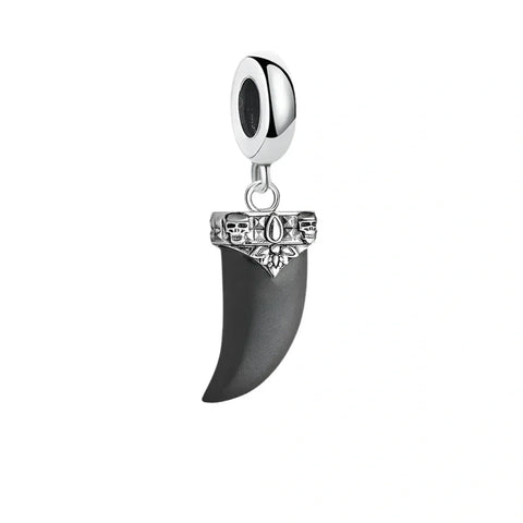 Silver and black fang charm.