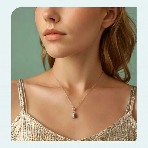 Gold necklace with a pendant.