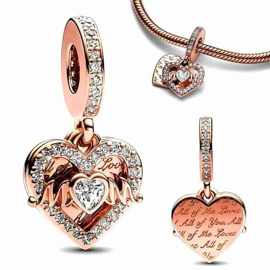 A heart-shaped "Mom" charm with diamonds and intricate details.