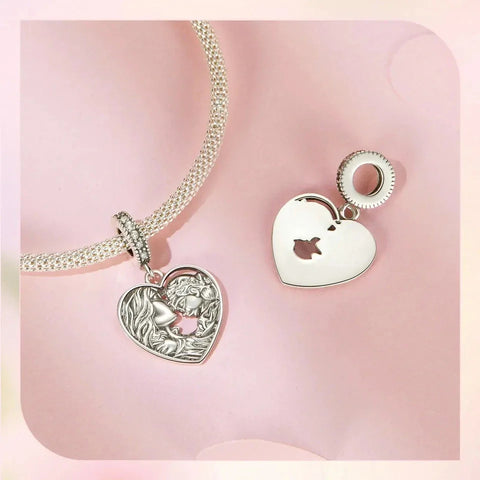Two heart-shaped silver charms.