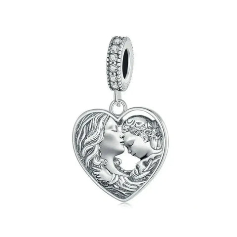 Silver heart pendant with mother and child design.