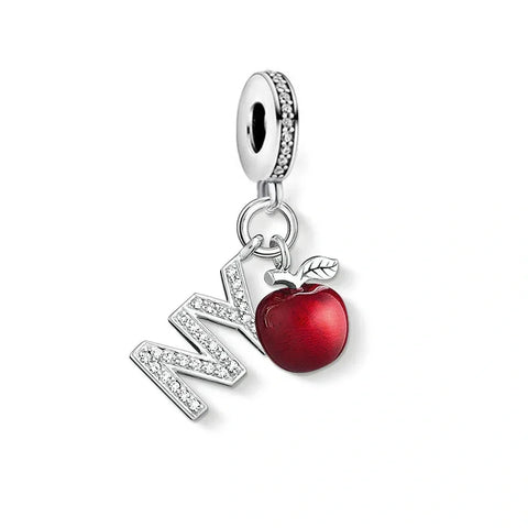 Silver charm with 'NY' and a red apple.