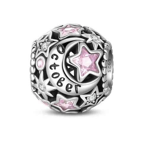 Silver charm with pink stars and moon.