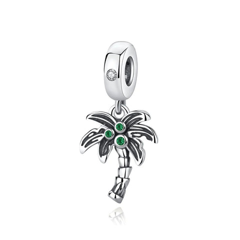 Silver Palm Tree Dangle Charm with Green Crystals - A silver oxidised palm tree dangle charm with three green cubic zirconia crystals in the fronds and a clear crystal on the clip-on bail, photographed on a white background.