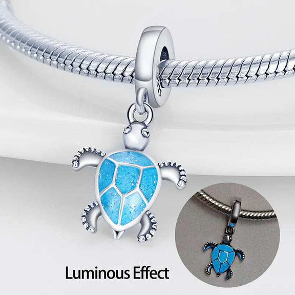 Glow In The Dark Turtle Dangle Charm - Sea turtle charm with blue enamel accents, made of sterling silver.