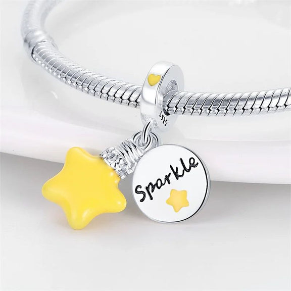 Sterling Silver Sparkle Charm with Yellow Star for Pandora Bracelets - Sterling silver charm for bracelets featuring a yellow star and a "Sparkle" pendant with a yellow star cutout, fits Pandora charms.