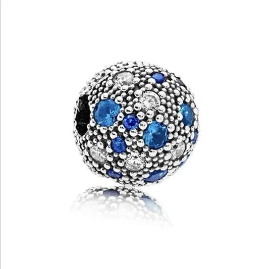 Sterling silver charm with blue and clear pave crystals for a sparkling, elegant touch.