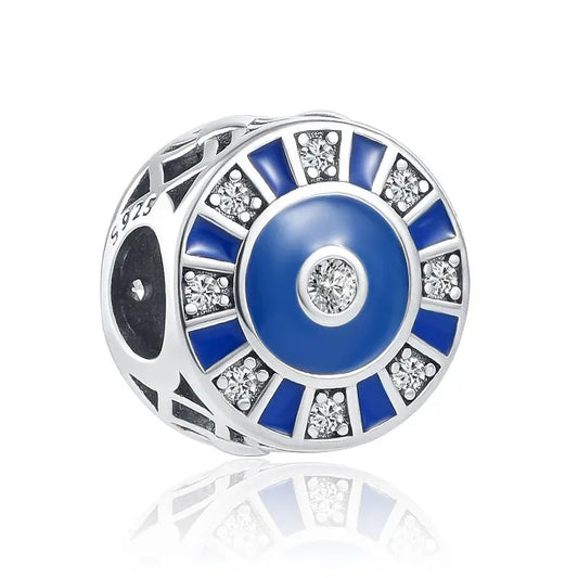 Sterling silver charm with alternating blue and white crystals for a striking, radiant design.