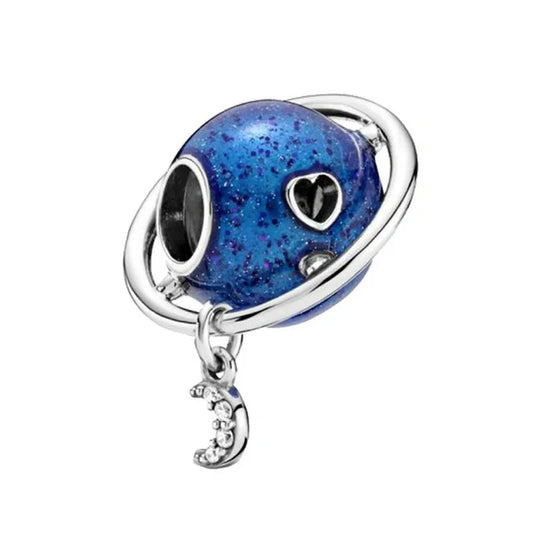 Sterling silver blue planet charm with glitter accents and a dangling crescent moon for a celestial design.