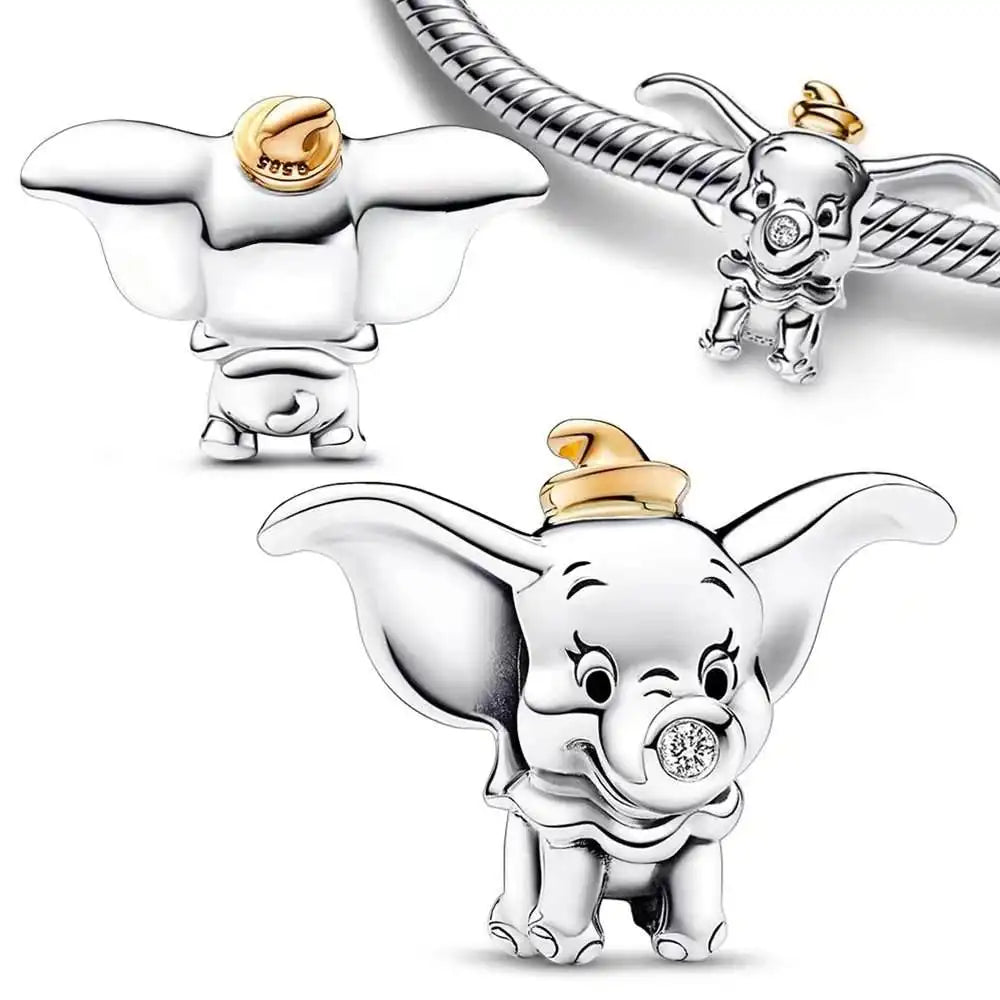 Sterling silver Dumbo charm with golden hat and sparkling diamond trunk detail.