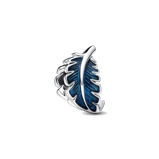 Sterling silver feather charm with blue enamel detailing for a nature-inspired, elegant design.