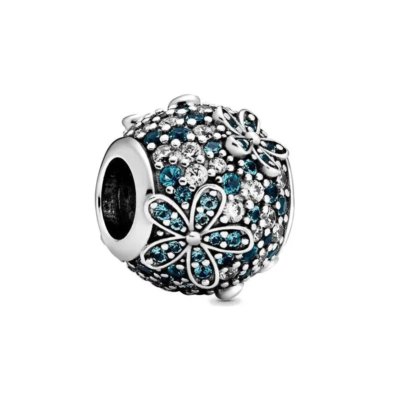 Sterling silver charm with teal and clear crystals in a floral design for a vibrant, sparkling look.