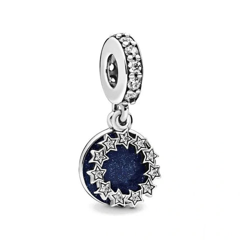 Hanging Star Charm with Blue Sparkle Enamel and Crystal Details - Sterling silver hanging charm with a deep blue enamel center surrounded by stars and sparkling crystals.
