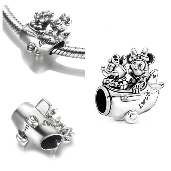 Mickey and Minnie Plane Charm - Sterling silver airplane charm featuring Mickey and Minnie with "Love" engraving.