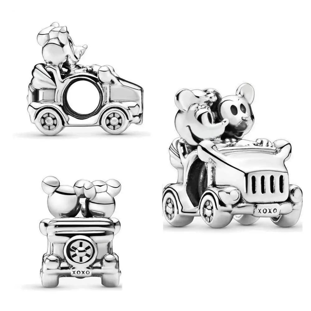 Mickey and Minnie Mouse charm featuring them on a car ride with romantic details in sterling silver.