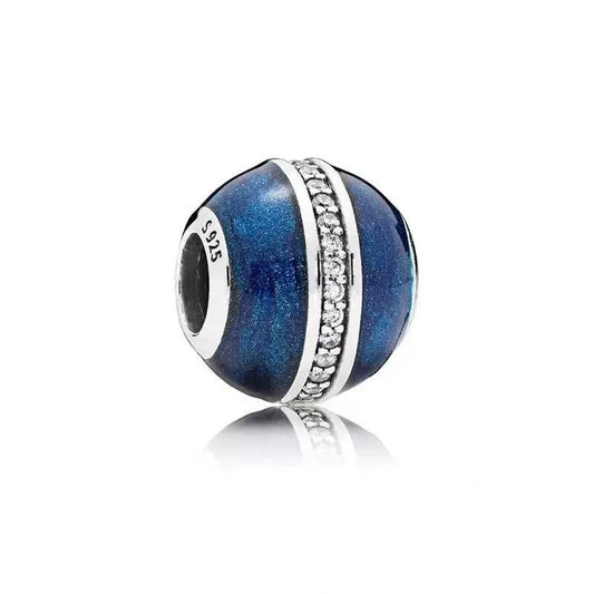 Sterling silver charm with midnight blue enamel and a crystal band for a sparkling, elegant look.