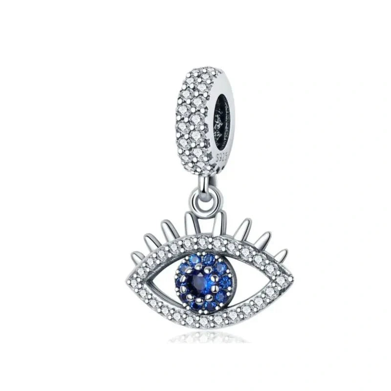 Star-shaped sterling silver charm encrusted with sapphire blue stones, perfect for adding celestial sparkle to charm bracelets.