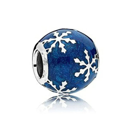 Sterling silver snowflake charm with blue enamel detailing for a festive winter design.