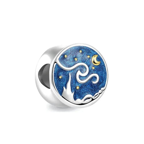 Sparkling Ocean Blue Stone Charm with Starry Cutouts - A sterling silver charm with a large ocean-blue faceted stone surrounded by small clear crystals and star cutout details.