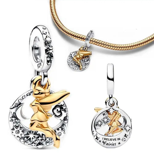 Sterling silver Tinker Bell charm with moon, star details, and gold accents.