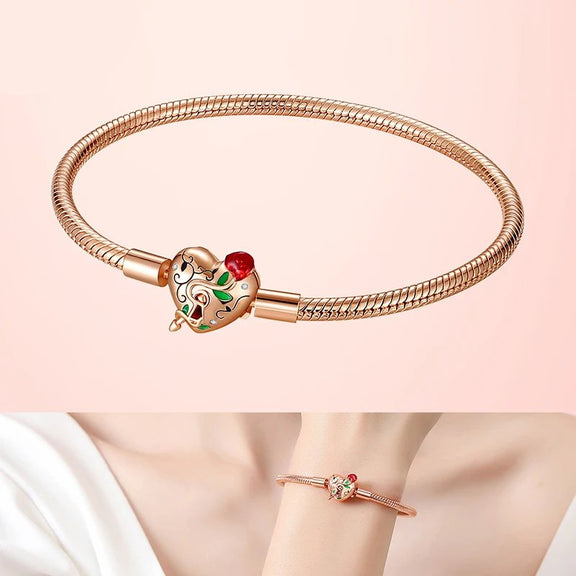 Rose Gold Enchanted Heart Clasp Charm Bracelet - Close-up of a rose gold bracelet with a heart clasp adorned with colorful enamel detailing.