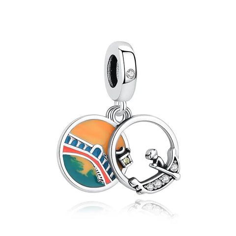 Paris Eiffel Tower & Gondola Sunset Enamel Charm - A silver clip-on charm featuring two hanging discs — one colorful enamel disc showing the Eiffel Tower at sunset, and one open silver ring charm depicting a gondolier with cubic zirconia accents