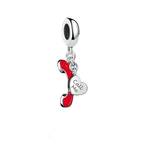 Red telephone and heart charm.