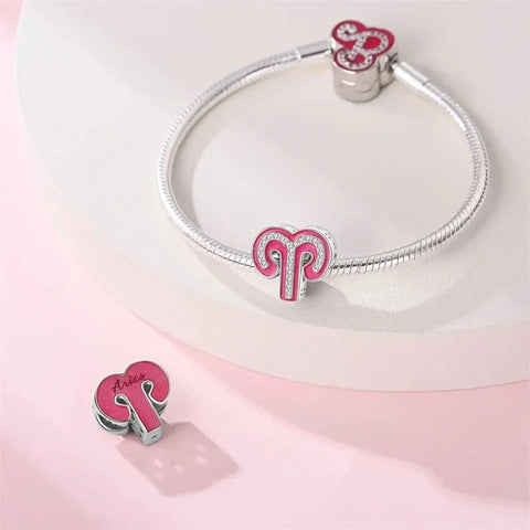Silver bracelet with Aries charms.