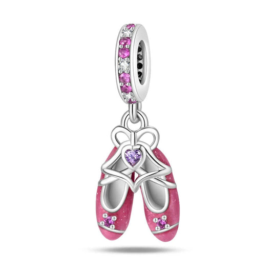 A pair of detailed pink ballet shoes, perfect for dance lovers and charm collectors.