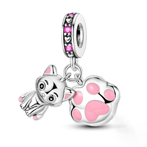 Pink Cat Paw Charm - Adorable pink cat paw charm with kitten details.