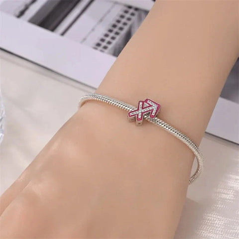 Silver bracelet with Sagittarius charm.