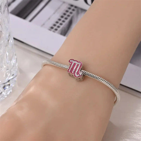 Silver bracelet with Scorpio charm.